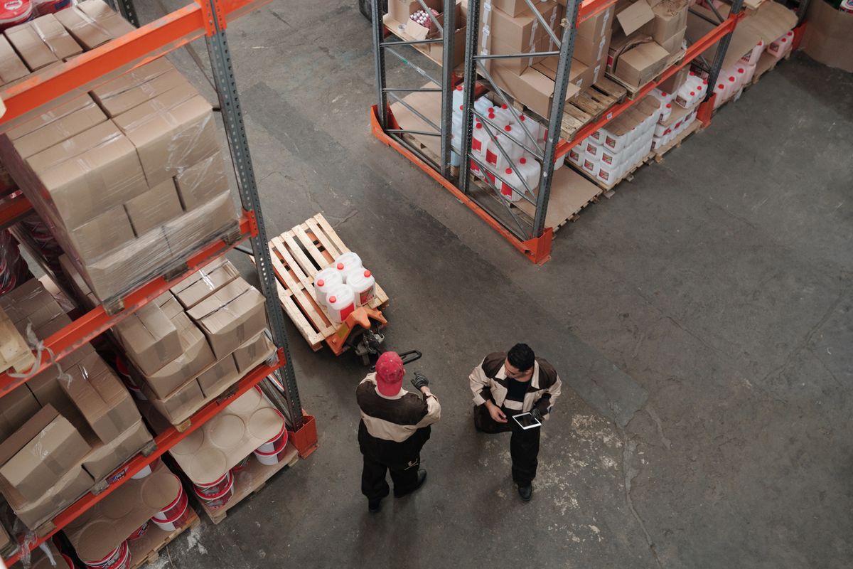 Warehouse team working with palletised stock